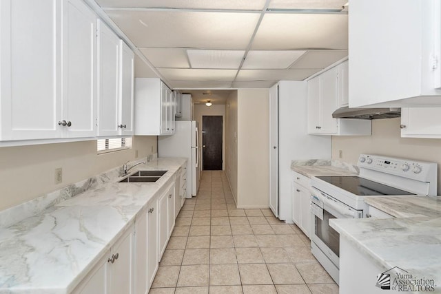 2413 W 13th Pl, Yuma, AZ 85364 - kitchen featuring white appliances, a sink, a drop ceiling, white cabinets, and light tile patterned flooring