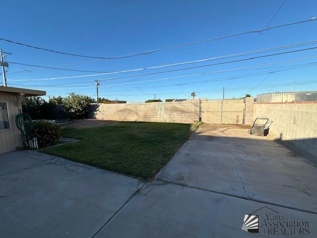 view of yard with a fenced backyard and a patio