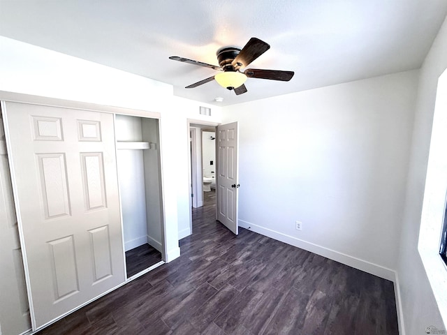 2472 S 18th Ave, Yuma, AZ 85364 - unfurnished bedroom featuring baseboards, a closet, dark wood-style flooring, and a ceiling fan