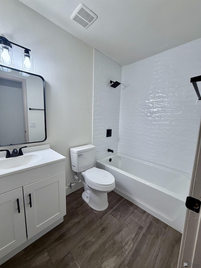 2472 S 18th Ave, Yuma, AZ 85364 - full bathroom featuring toilet, vanity, wood finished floors, and washtub / shower combination