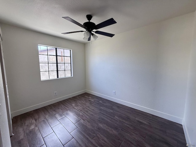 2472 S 18th Ave, Yuma, AZ 85364 - spare room featuring dark wood finished floors, ceiling fan, and baseboards