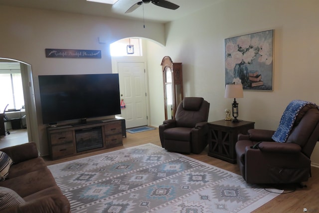 living room featuring ceiling fan and light wood-type flooring