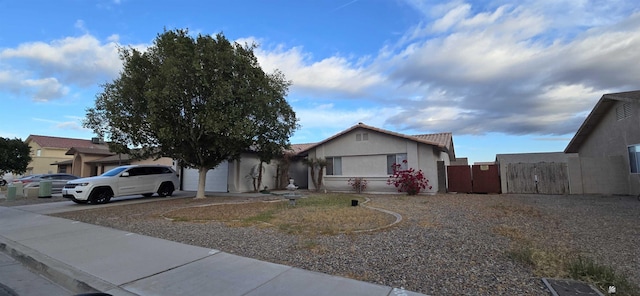 ranch-style house featuring a garage