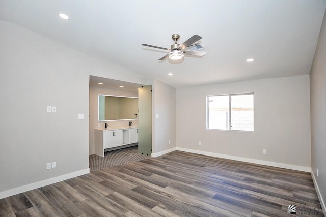 interior space featuring ceiling fan and dark hardwood / wood-style flooring