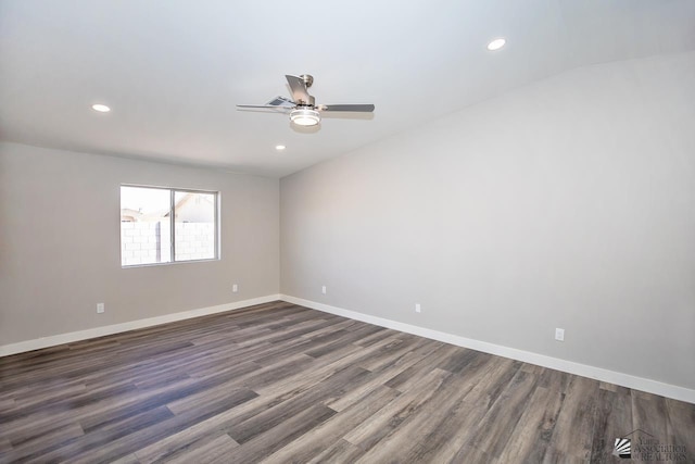 unfurnished room with ceiling fan and dark hardwood / wood-style floors