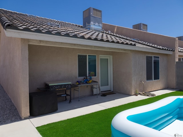 7335 E 36th Rd, Yuma, AZ 85365 - back of house with a patio, a tile roof, and stucco siding