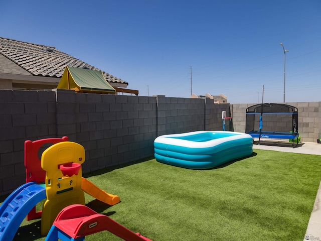 7335 E 36th Rd, Yuma, AZ 85365 - view of yard with a trampoline
