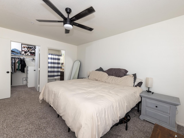 7335 E 36th Rd, Yuma, AZ 85365 - carpeted bedroom with a spacious closet, a ceiling fan, and connected bathroom