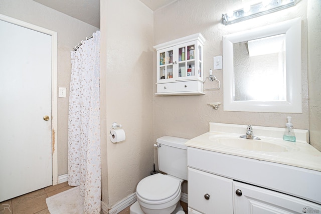 2556 W 14th St, Yuma, AZ 85364 - bathroom with vanity, toilet, tile patterned floors, and curtained shower