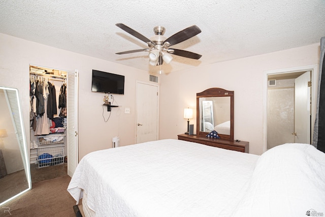 2556 W 14th St, Yuma, AZ 85364 - carpeted bedroom with a closet, a walk in closet, a textured ceiling, and ceiling fan