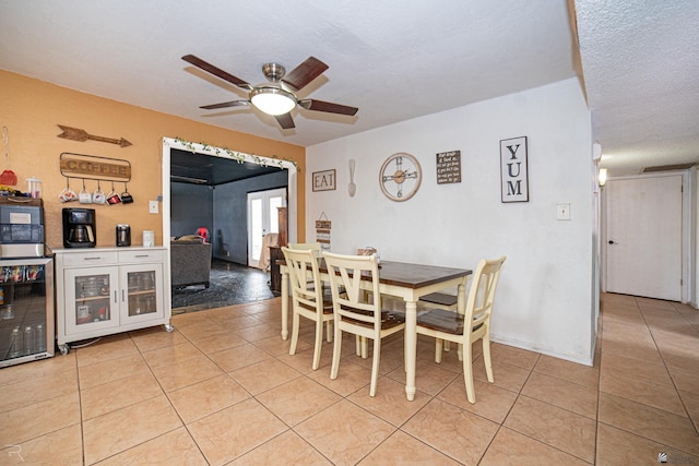 2556 W 14th St, Yuma, AZ 85364 - dining area featuring wine cooler, ceiling fan, and light tile patterned flooring