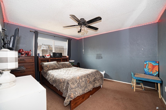 2556 W 14th St, Yuma, AZ 85364 - bedroom with a textured ceiling, a textured wall, baseboards, carpet floors, and a ceiling fan