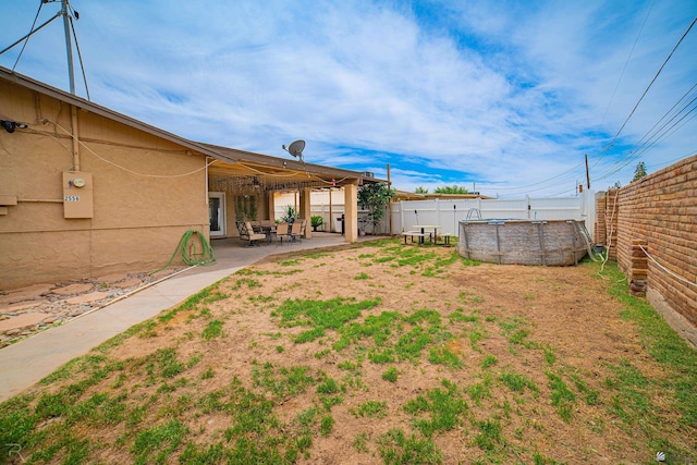 2556 W 14th St, Yuma, AZ 85364 - fenced backyard featuring a patio area