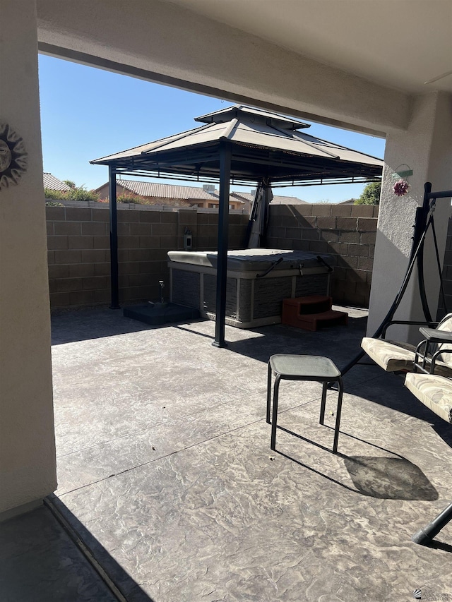 11785 E 27th Pl, Yuma, AZ 85367 - view of patio featuring a gazebo, a hot tub, and a fenced backyard