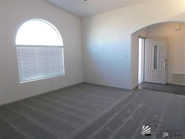 11785 E 27th Pl, Yuma, AZ 85367 - carpeted empty room featuring arched walkways