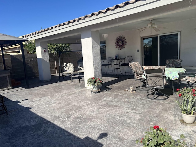 11785 E 27th Pl, Yuma, AZ 85367 - view of patio featuring ceiling fan, outdoor dining area, fence, and a gazebo