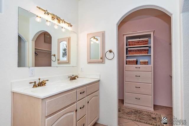 13400 S Onammi Ave, Yuma, AZ 85367 - bathroom featuring double vanity, tile patterned flooring, and a walk in closet