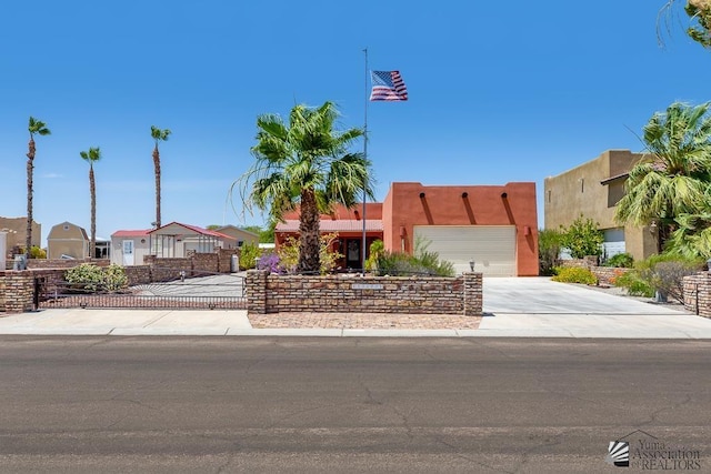13400 S Onammi Ave, Yuma, AZ 85367 - view of front facade with concrete driveway, a garage, a residential view, and stucco siding