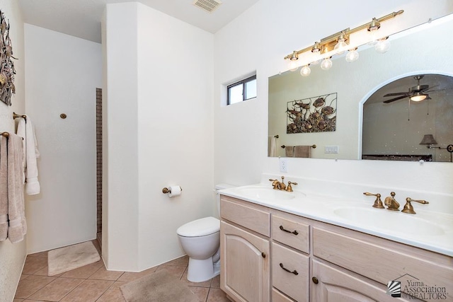 13400 S Onammi Ave, Yuma, AZ 85367 - full bathroom featuring double vanity, tile patterned flooring, ceiling fan, and a shower
