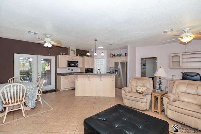13400 S Onammi Ave, Yuma, AZ 85367 - living room with a ceiling fan, light tile patterned flooring, and a textured ceiling
