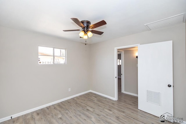2735 S Mesa Ave, Yuma, AZ 85364 - spare room featuring light wood finished floors, a ceiling fan, and baseboards