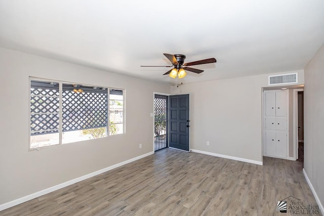 2735 S Mesa Ave, Yuma, AZ 85364 - spare room featuring a ceiling fan, wood finished floors, and baseboards