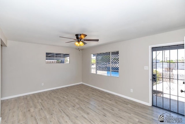 2735 S Mesa Ave, Yuma, AZ 85364 - spare room with light wood-style floors, a ceiling fan, and baseboards