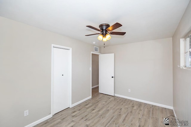 2735 S Mesa Ave, Yuma, AZ 85364 - unfurnished bedroom featuring light wood-style flooring, baseboards, a closet, and ceiling fan