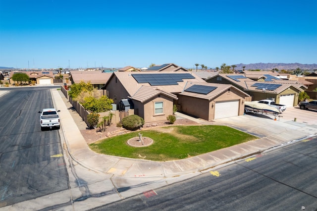 7942 E 36th Ln, Yuma, AZ 85365 - view of front of property with a residential view, stucco siding, an attached garage, driveway, and a mountain view