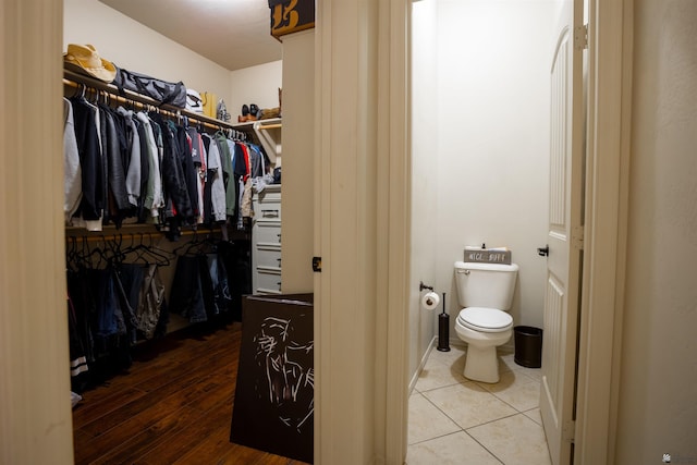 7942 E 36th Ln, Yuma, AZ 85365 - bathroom with toilet, a spacious closet, and wood finished floors
