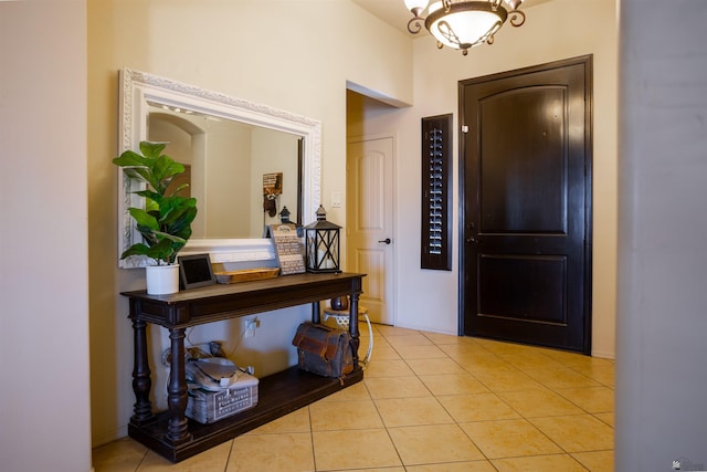 7942 E 36th Ln, Yuma, AZ 85365 - entryway featuring light tile patterned flooring and a chandelier