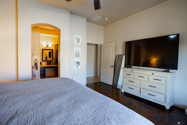7942 E 36th Ln, Yuma, AZ 85365 - bedroom featuring arched walkways, dark wood-type flooring, ensuite bathroom, and a ceiling fan
