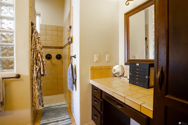 7942 E 36th Ln, Yuma, AZ 85365 - bathroom featuring tiled shower, vanity, and tile patterned floors