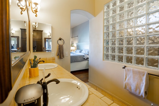 7942 E 36th Ln, Yuma, AZ 85365 - bathroom with double vanity, a chandelier, connected bathroom, and tile patterned flooring