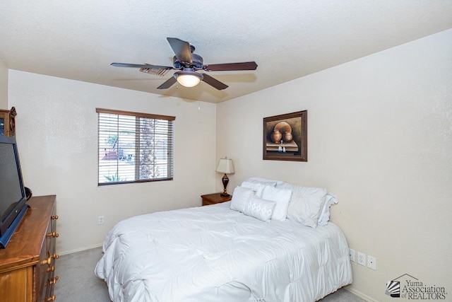 bedroom with baseboards, carpet, and a ceiling fan