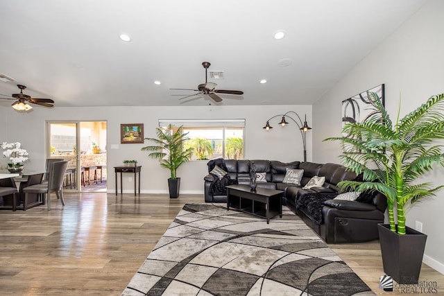 living room featuring recessed lighting, a ceiling fan, light wood finished floors, and visible vents