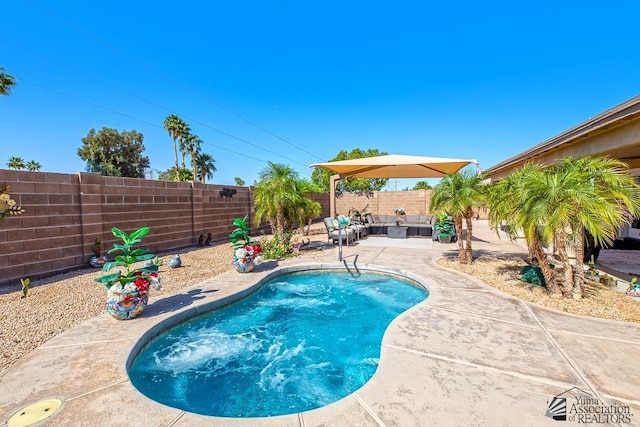 view of pool with an outdoor living space, a fenced backyard, a fenced in pool, and a patio