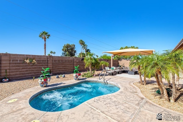 view of pool featuring a fenced in pool, a fenced backyard, a patio area, and an outdoor hangout area