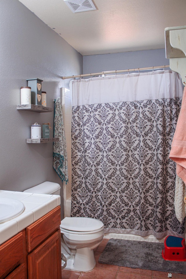 full bath with visible vents, shower / bath combo, toilet, and vanity
