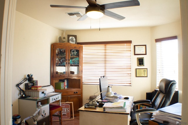 office featuring ceiling fan and visible vents