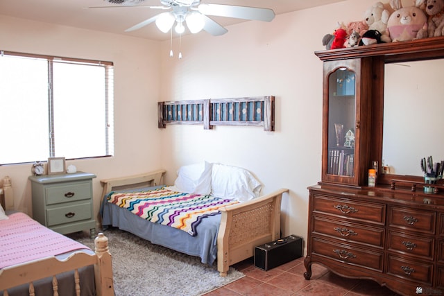 bedroom featuring tile patterned flooring and ceiling fan