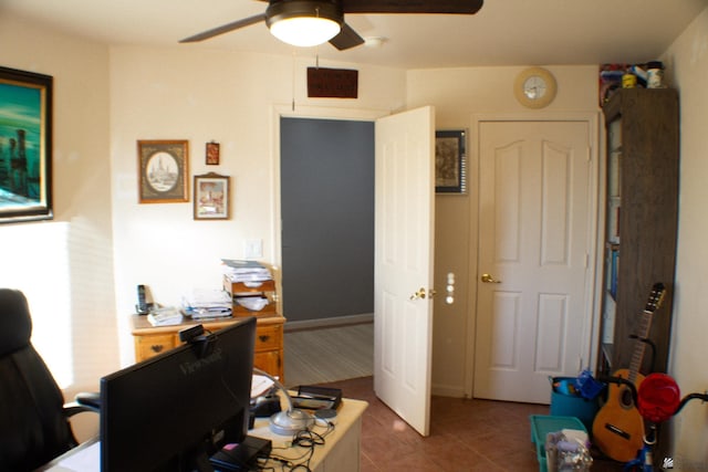 office space featuring ceiling fan and tile patterned floors
