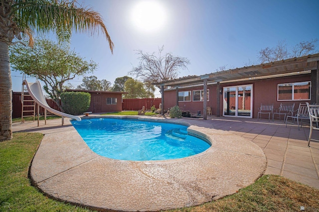 view of swimming pool featuring a water slide, a fenced backyard, a patio, an outbuilding, and a pergola
