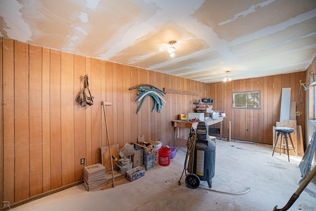 misc room featuring wooden walls