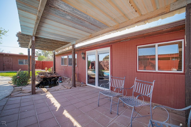 view of patio featuring fence