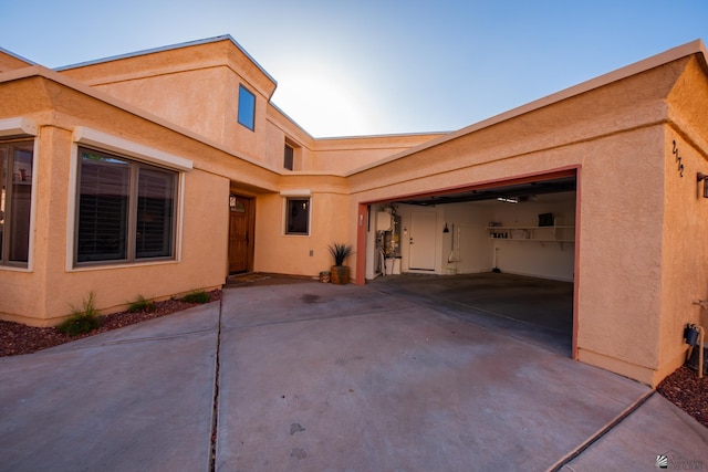 2172 S Terrace Way, Yuma, AZ 85364 - view of side of home with driveway, an attached garage, and stucco siding