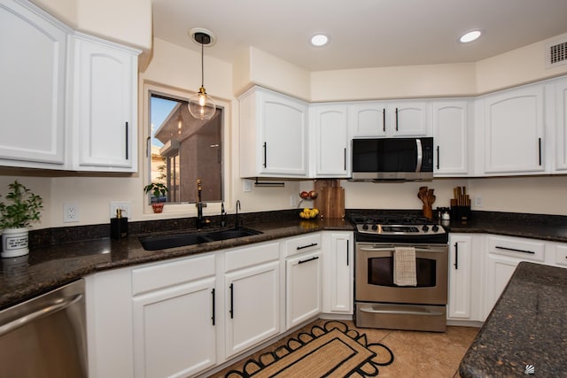 2172 S Terrace Way, Yuma, AZ 85364 - kitchen featuring stainless steel appliances, a sink, white cabinets, dark stone countertops, and recessed lighting