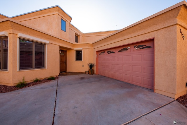 2172 S Terrace Way, Yuma, AZ 85364 - view of front of property featuring stucco siding, driveway, and an attached garage