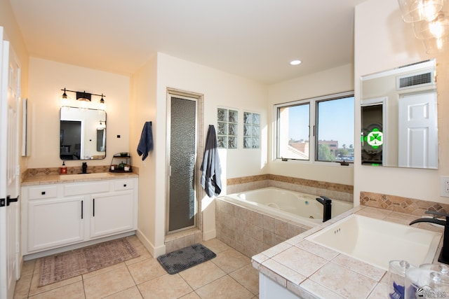 2172 S Terrace Way, Yuma, AZ 85364 - bathroom featuring tile patterned floors, a tub with jets, a stall shower, vanity, and recessed lighting