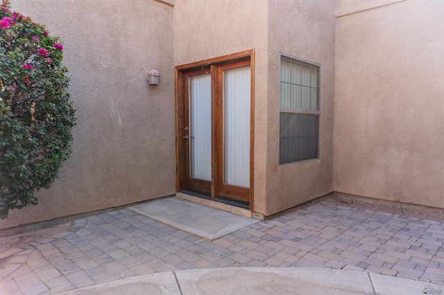 4599 La Quinta Ln, Yuma, AZ 85364 - view of exterior entry with a patio area and stucco siding